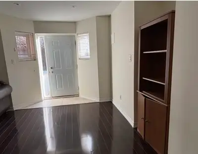 This spacious, one bedroom well-lit walkout basement features beautiful dark hardwood flooring, a mo...