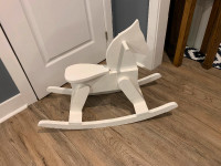 White wooden rocking horse - perfect for a nursery!