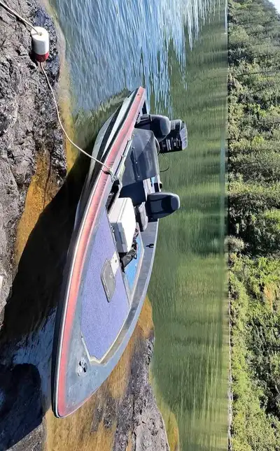 16' boat, don't expect much visually, it needs work still but it floats and gets up to speed. 135 V6...