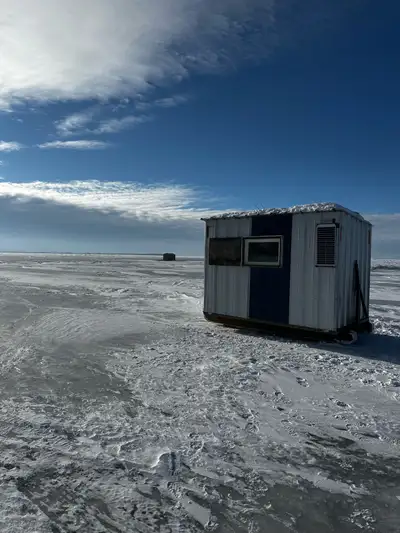 Approx 10x6, fully insulated, wood stove, tow bar/ hitch, new skies, solar panel to run lights and 1...