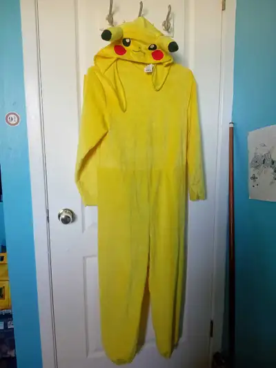 Pikachu Pokémon official costume- 2 pieces includes hat/head piece Like NEW, worn once Size: 10-12 y...