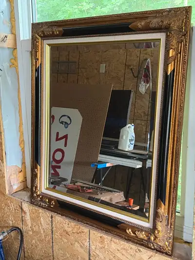 Add a touch of elegance to your home with this beautiful, pre-loved wall mirror featuring an ornate,...