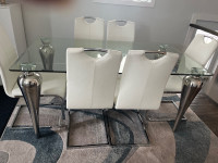 Beautiful Airy Elegant glass dining table with six chairs. 