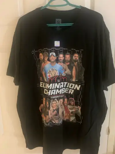 Size 2XL official WWE Elimination Chamber T-shirt, never worn with WWE hologram sticker still attach...