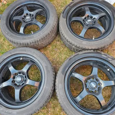 selling four 17 inch all season tires with Motegi Mr131 light weight flow form alloy rims for $900....