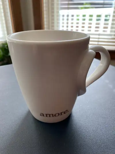- Used Starbucks white Barista mug, issued 2003, with heart-shaped handle and “amore.” text - Used,...