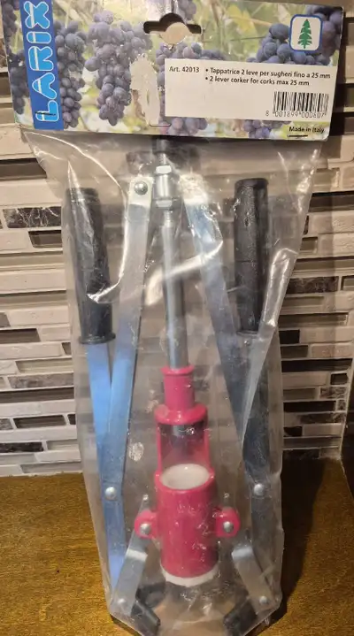 New sealed in packaging Add a cork, push down the levers, and the cork is inserted. Made of steel. M...