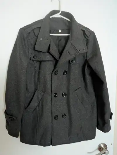 Might never have been worn. Color is grey. Lined. No tags to say what the fabric is.