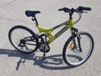 Green 24 in MOUNTAIN bicycle disc brake dual suspension