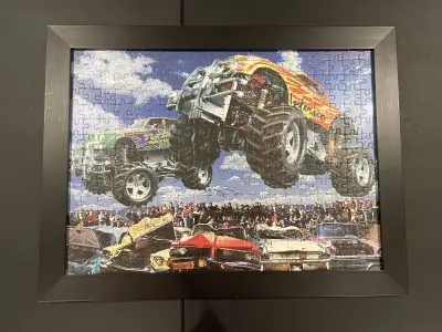 Get ready to rev up your engines with this framed monster truck puzzle! This used puzzle captures a...