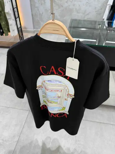 This brand new Casablanca T-shirt features a stunning graphic print on a comfortable, high-quality b...