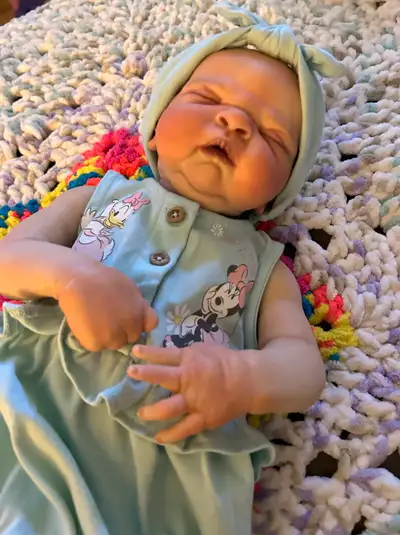 This is Reborn Maggie kit. She is about 20 inches long full body vinyl. She comes with her outfit, b...
