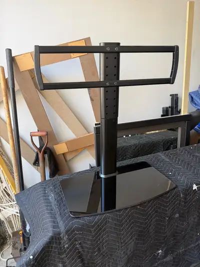 TV mount with stand. Do not have the bracket that would sit on TV. You will need that. Can hold up t...