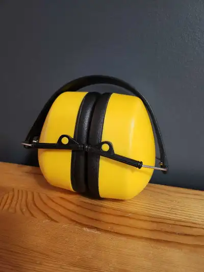 Yellow noise cancelling earmuffs, perfect for hearing protection in noisy environments! They're comf...
