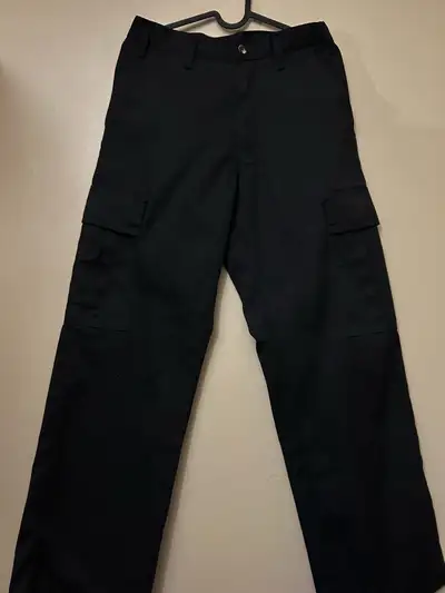 Offering a pair of Big Bill black work pants, sized at 28x34, these durable pants are ideal for any...
