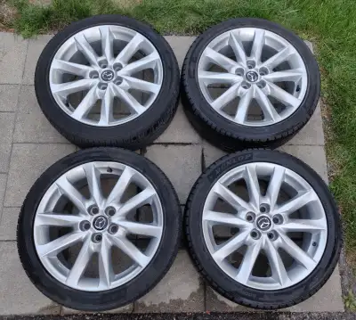 Selling a set of four (4) OEM Factory Mazda3 18 inch silver metallic alloy rims with tires. $550 for...