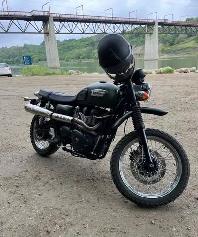 Mint cond. low Kms. Custom pipe and fender. Second owner. Always stored indoors.