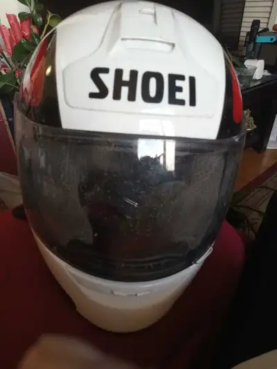 Selling a used Shoei helmet, perfect for motorcycle enthusiasts looking for reliable head protection...
