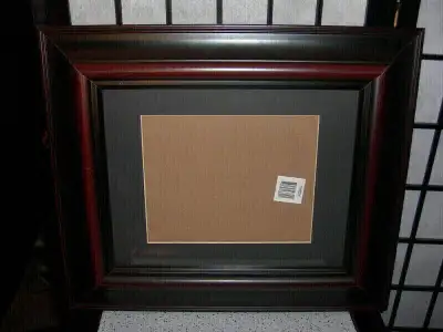 This is a quality, lawyer office looking picture frame. It's like-new and is chocolate brown and for...