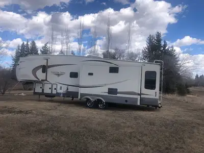 2012 Canyon Trail by Cedar Creek, 39 ft. 5th wheel trailer for sale. Very suitable for lake lot or g...