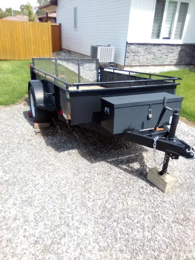 It is a 2021 5x8 utility trailer. Not used alot. With bifold ramp and a toolboxes. Has 4 tie down ri...