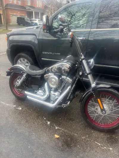 2016 street bob. Only 1000kms on bike. Rode it only one summer. Have 3,000 dollars rims in black sti...