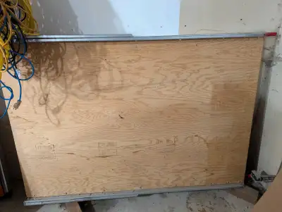 3/4" plywood, folds in half.