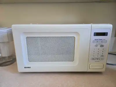 This is a compact Kenmore microwave, perfect for smaller kitchens or office spaces, offering conveni...
