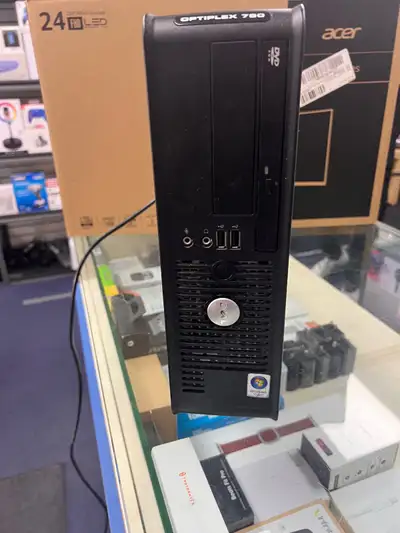 This is a used Dell Optiplex 780 desktop computer, perfect for basic computing tasks, equipped with...