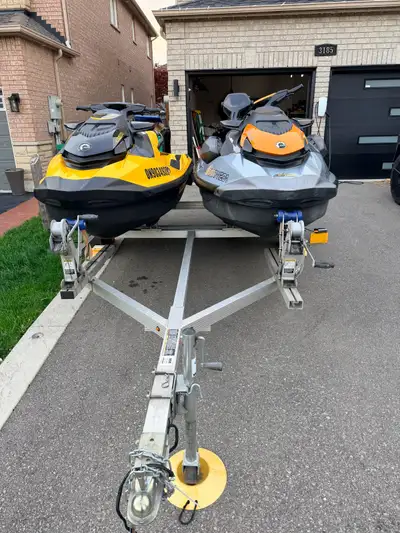 Pair of Sea-Doos + Dual Trailer Two pristine Sea-Doos, meticulously maintained, loaded with accessor...