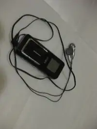 Pocket size digital AM/FM radio with ear buds