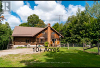 10 acre hobby farm with log home for sale