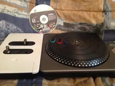 Everything you need to play DJ Hero on the Xbox 360 (batteries not included). Has been tested.