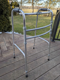 LUMEX 6050 FOLDING WALKER, ADULT SIZE. SINGLE BUTTON RELEASE.