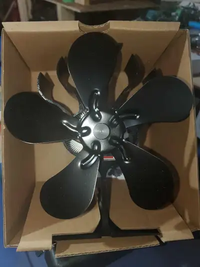 Enhance your wood stove's efficiency with this five-blade heat powered fan, designed to circulate wa...