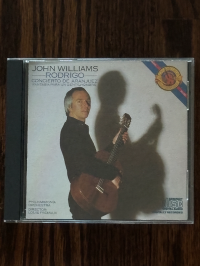 I am offering a CD of John Williams with the Philharmonia Orchestra conducted by Louis Fremaux perfo...