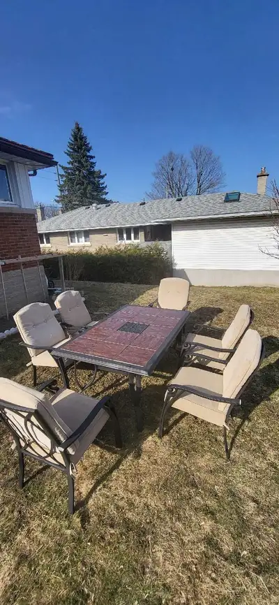Used good condition Lazboy patio table with tile on top , 6 chairs with chusion, material aluminum v...