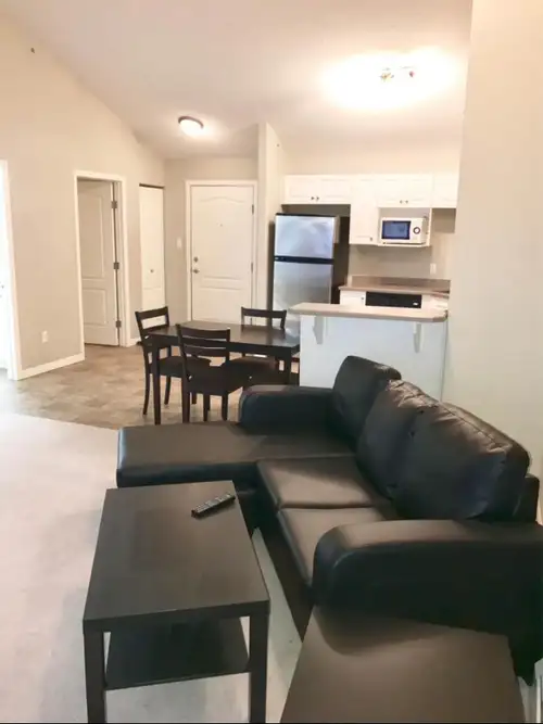 Flexible Lease for Furnished Top Floor Condo with balcony; delivers an open concept layout with in s...
