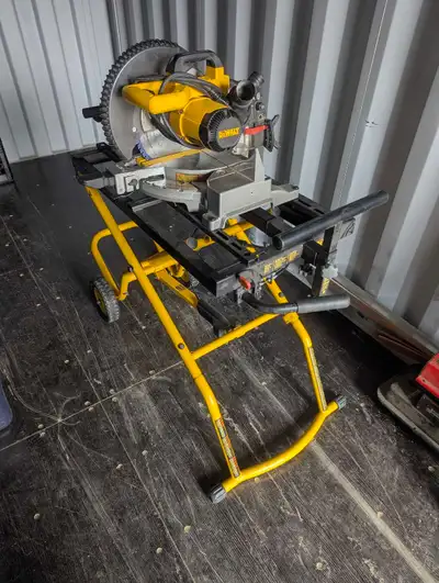 Complete DeWalt DW713 10 inch compound miter saw with a rolling stand. Saw has a 10 inch blade. Stan...