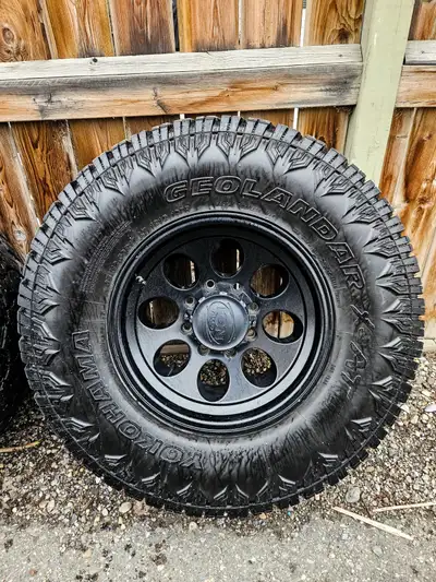 17x9.5 bullet hole black ions in great shape with caps. 35 12.5 r17 yokohama geolander X-AT tires wi...