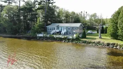 Escape to your own private lakeside retreat with this charming 2-bedroom, 1-bath home situated on ov...