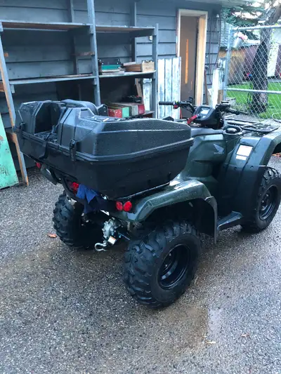 Honda 420 with storage box and seat. 2500 pound warn winch. Used for one hunting season.
