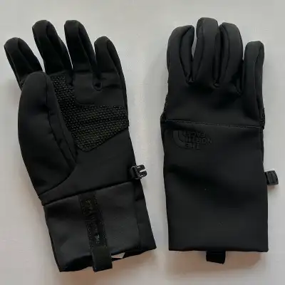 Keep your hands warm and protected with these The North Face lightweight winter windproof and water...