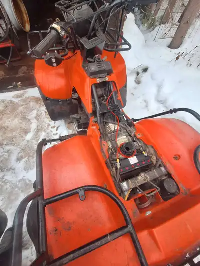 1985 suzuki quadrunner 250 comes with a plow will trade for a ridding lawnmower of equal value