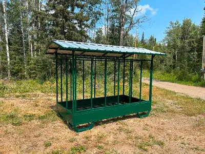 Covered hay feeder built to accommodate large square bales. Keeps your hay dry and animals safe! Lar...