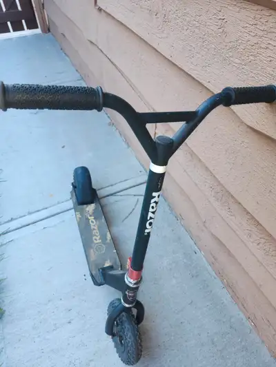 Scooter with air filled tires, good on most surfaces, 220 pound, 100 kg weight.