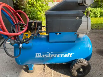 This is a Mastercraft air compressor with an 8-gallon tank, perfect for various inflation and tool-p...