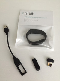 Various Fitbit fitness trackers watches, chargers, accessories