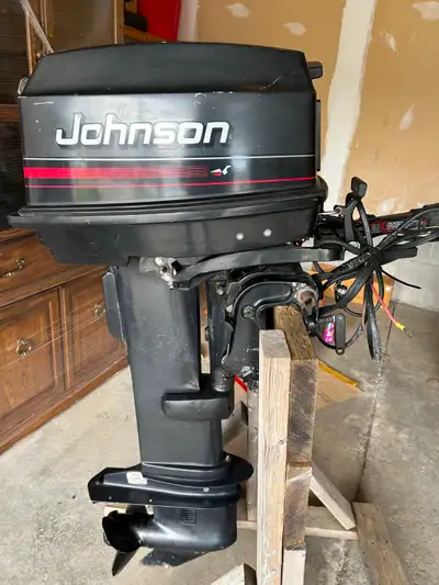 Outboard motor. Johnson 30hp, electric start, 2 stroke. Long shaft. I measure 33 inches from the tra...