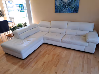 White Italian Leather sectional couch. Well cared for and in very good condition overall with less t...